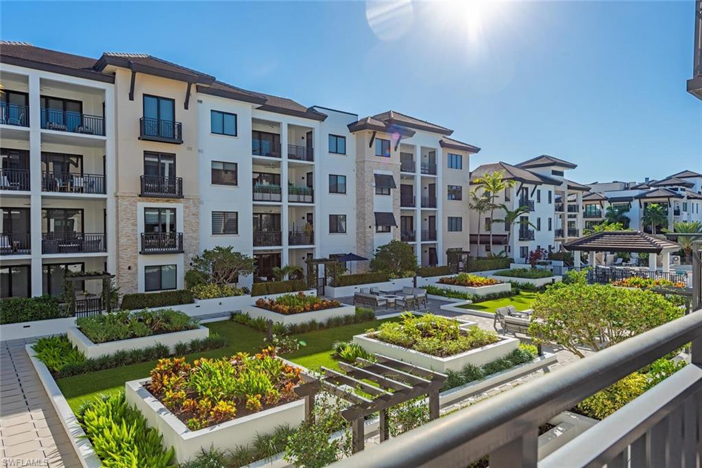 1135 3rd Avenue South, Unit 308 Naples, FL 34102 - Photo 15 of 18 a view of swimming pool with outdoor seating