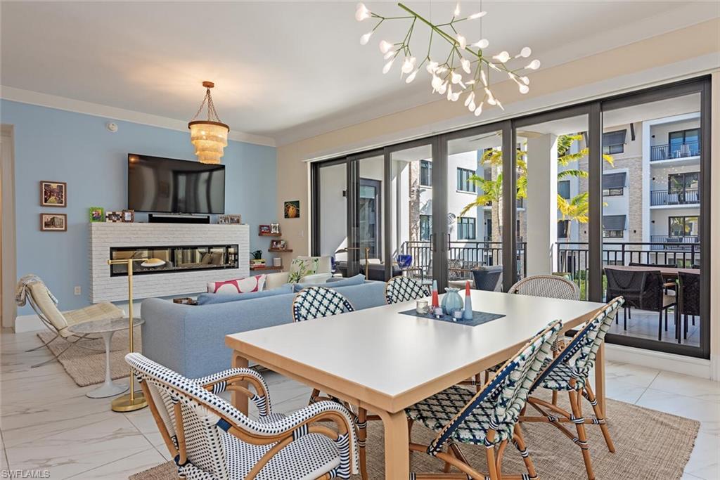 1135 3rd Avenue South, Unit 308 Naples, FL 34102 - Photo 2 of 18 a view of a dining room with furniture window and outside view