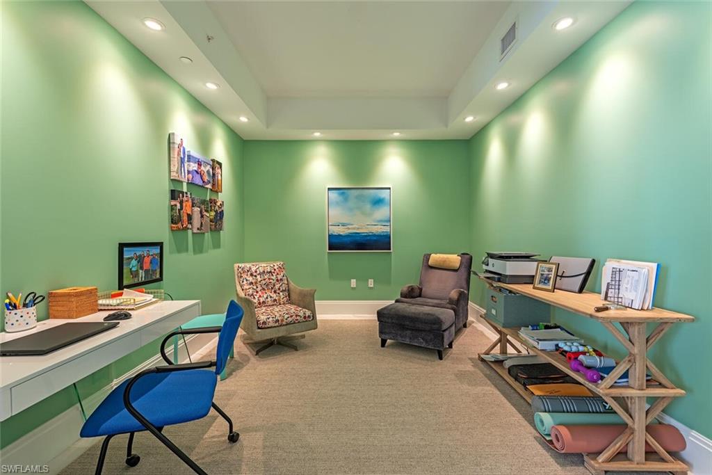 1135 3rd Avenue South, Unit 308 Naples, FL 34102 - Photo 9 of 18 a reading room with furniture and a wooden floor