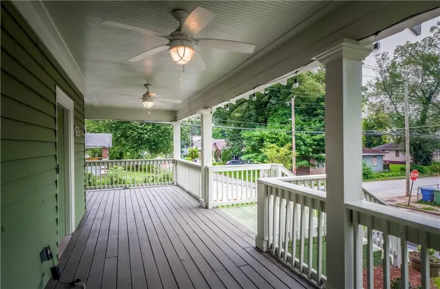 a view of a porch with wooden floor