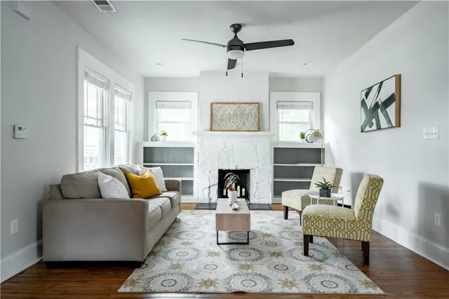 a living room with furniture and a fireplace