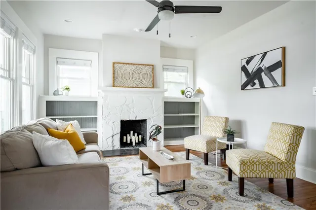 a living room with furniture and a fireplace