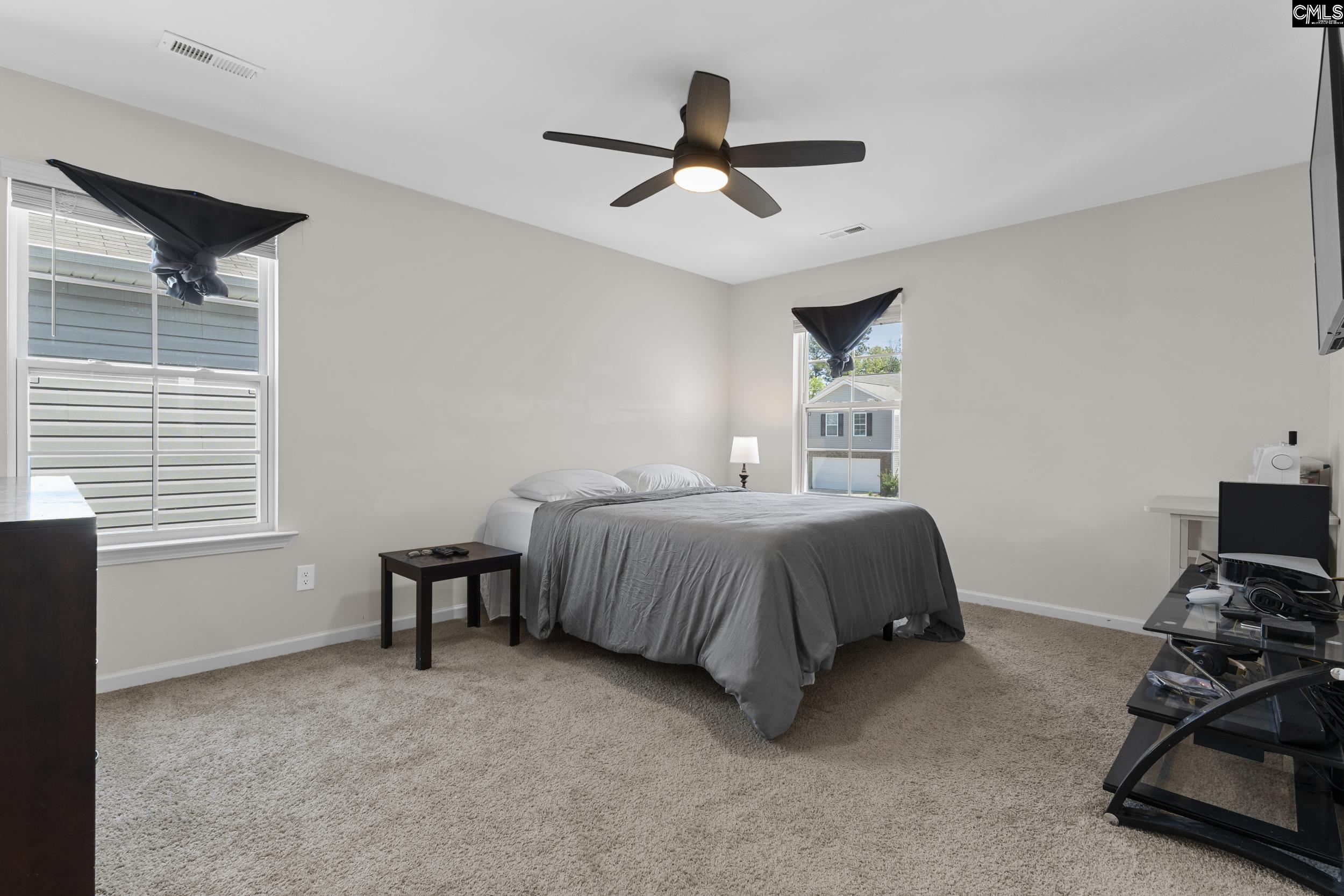 2097 Elmridge Road Columbia, SC 29209 - Photo 4 of 9 a bedroom with a bed and a ceiling fan