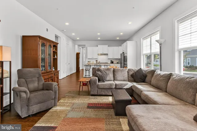 a kitchen with stainless steel appliances kitchen island granite countertop a refrigerator stove microwave and sink