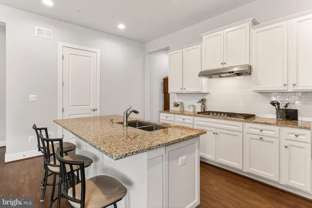 a bedroom with bed and a chandelier