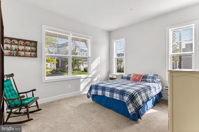 a view of a house with backyard and porch