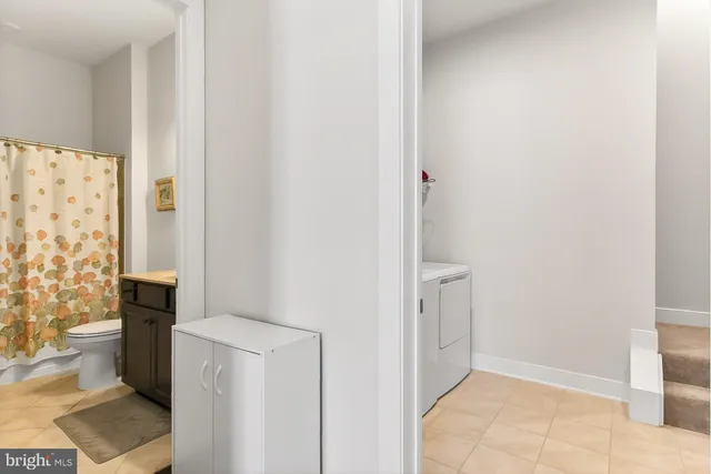 a living room with furniture and large windows