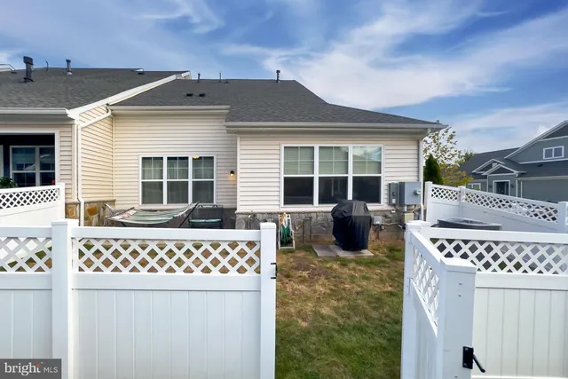 a view of a house with swimming pool and porch