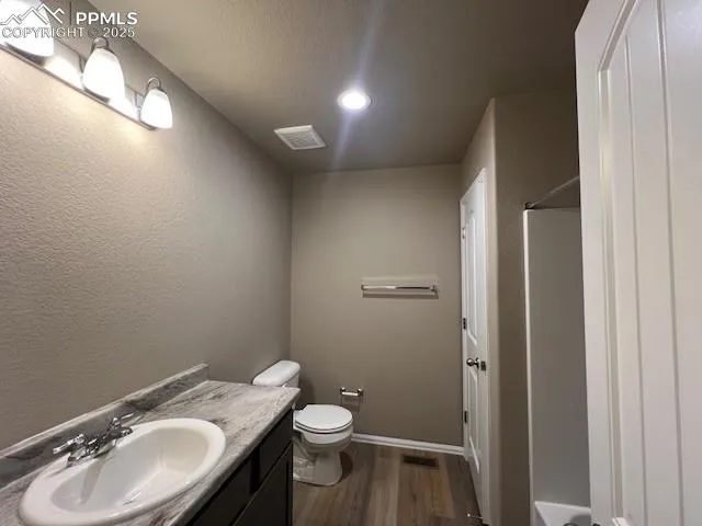 a bathroom with a sink and a toilet