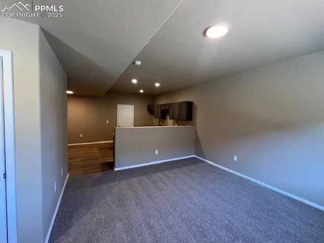 a view of a livingroom and a kitchen