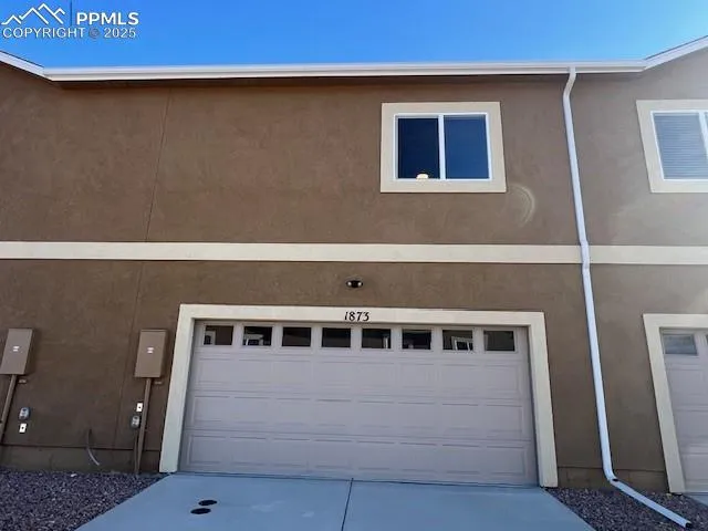 a view of a house with a large window