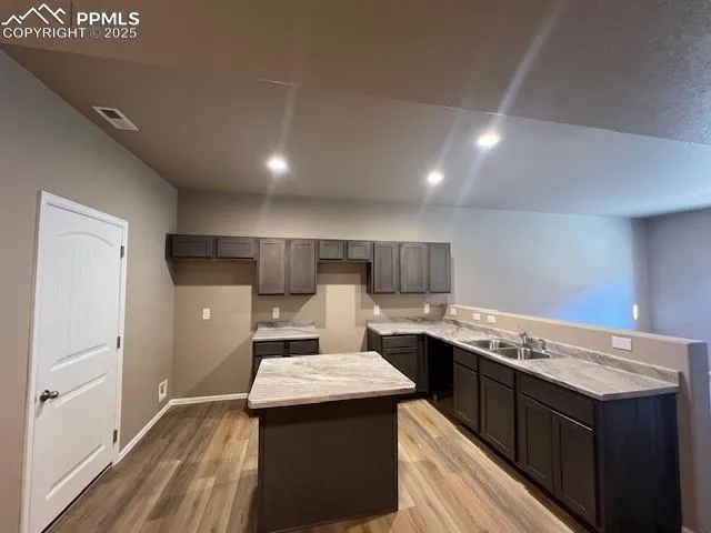 a kitchen with a stove and a refrigerator