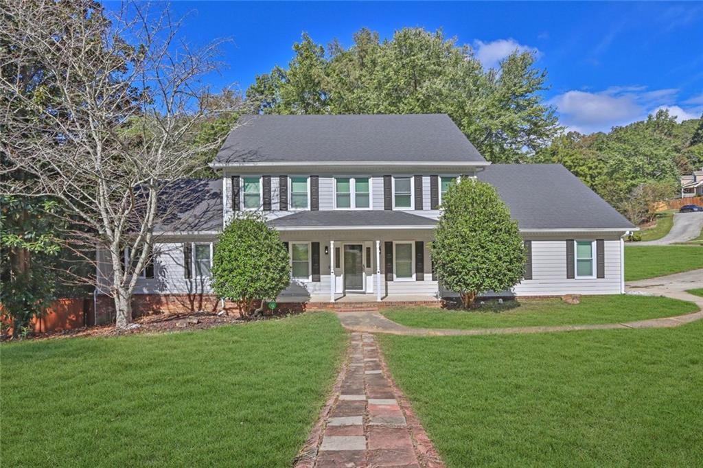 a front view of a house with a yard