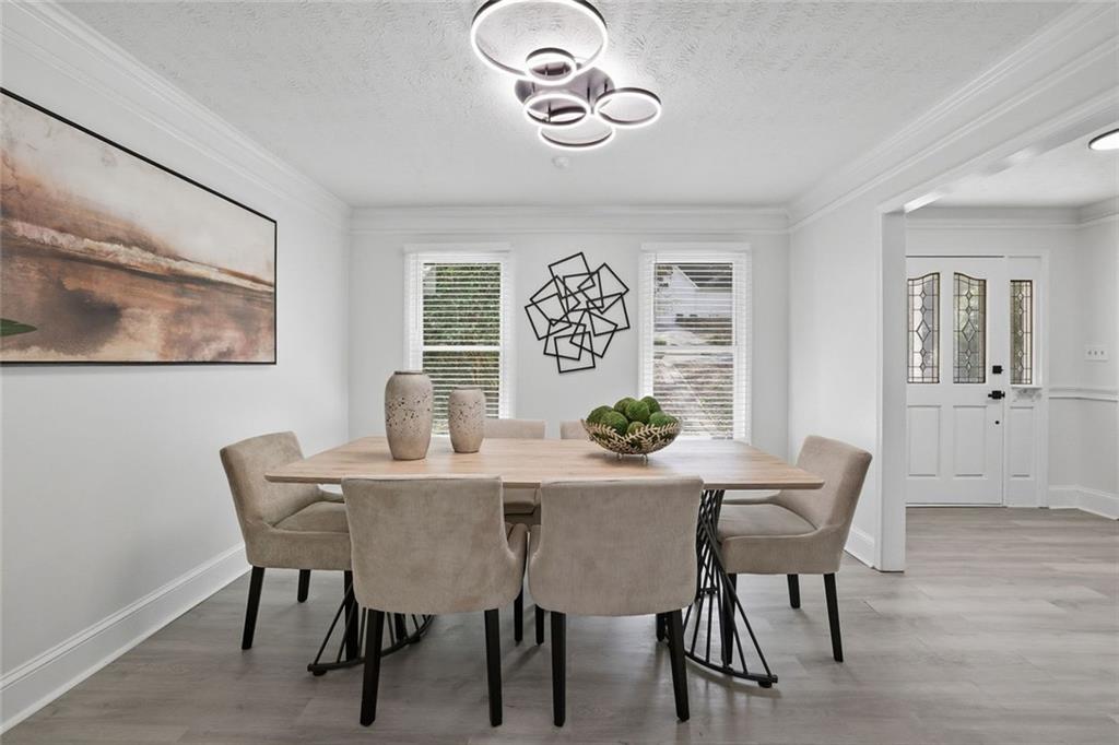 4645 Riveredge Cove Snellville, GA 30039 - Photo 16 of 43 a view of a dining room with furniture and wooden floor