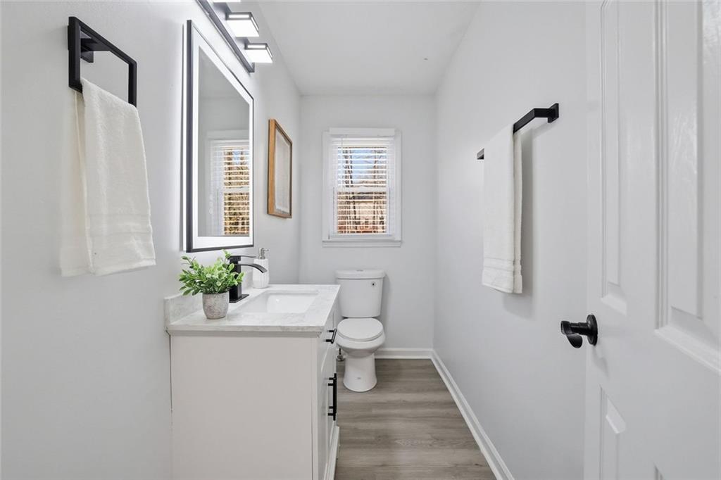 4645 Riveredge Cove Snellville, GA 30039 - Photo 28 of 43 a bathroom with a sink toilet and shower