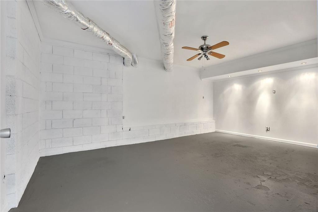 4645 Riveredge Cove Snellville, GA 30039 - Photo 36 of 43 an empty room with a ceiling fan and carpet