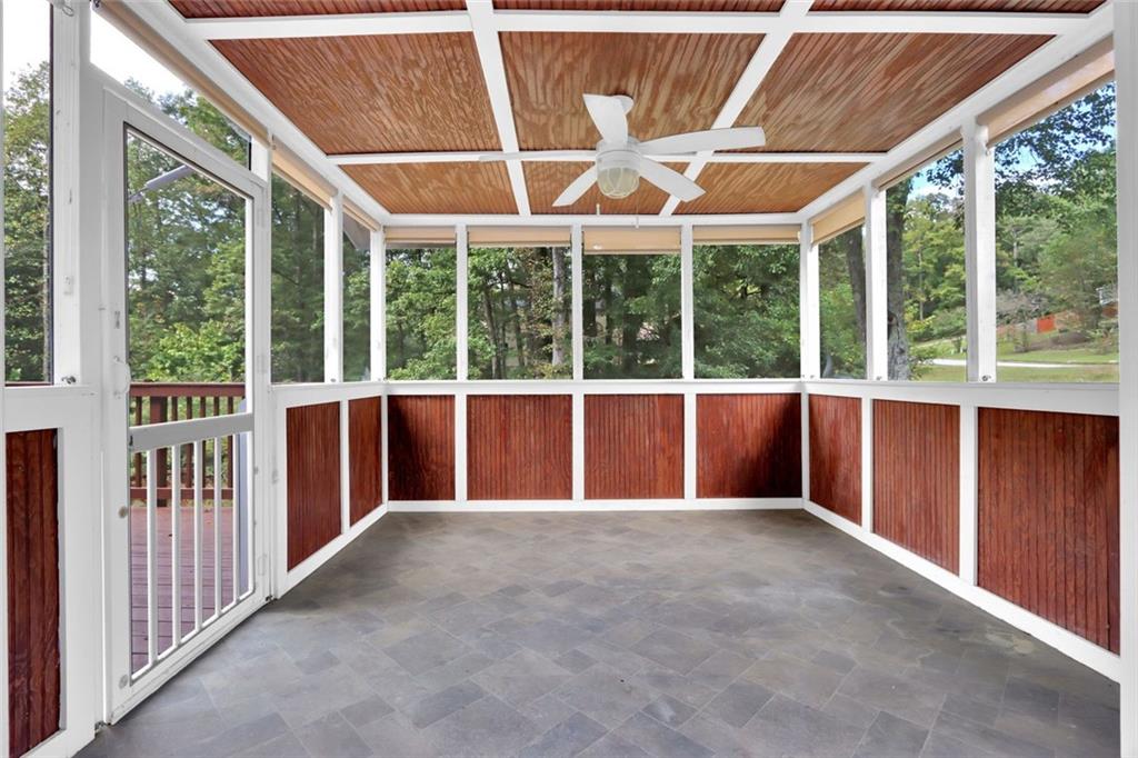 4645 Riveredge Cove Snellville, GA 30039 - Photo 38 of 43 a view of a porch with a backyard