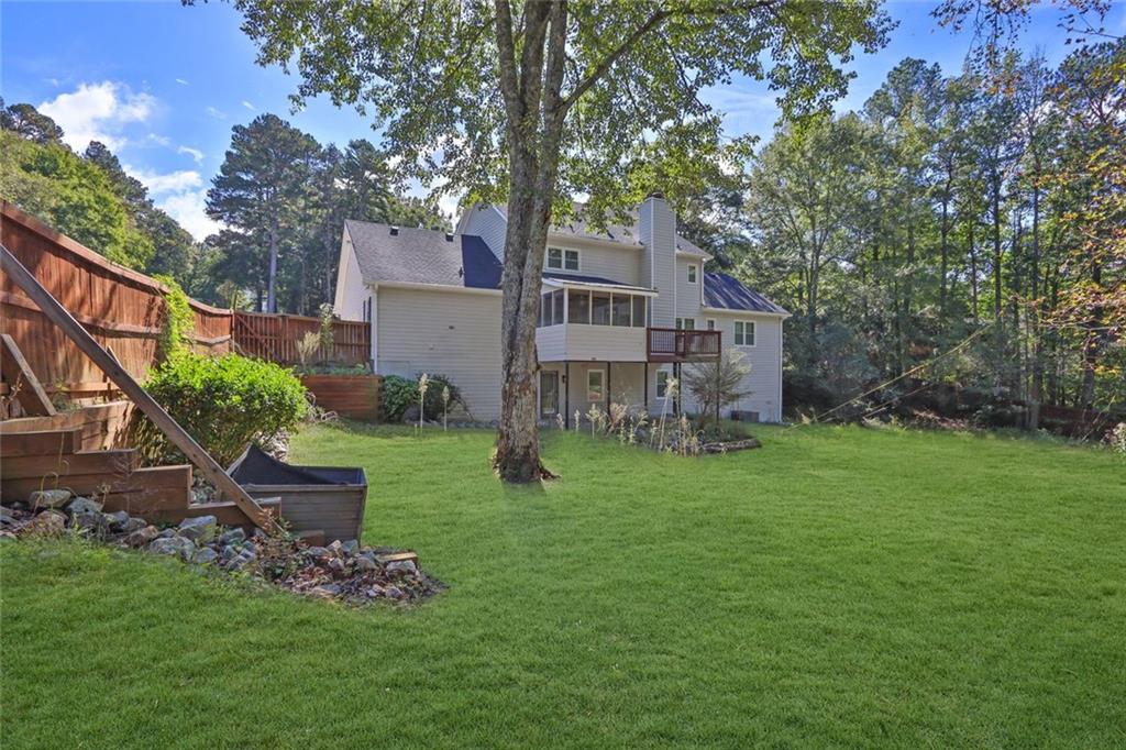 4645 Riveredge Cove Snellville, GA 30039 - Photo 41 of 43 a view of a house with a yard