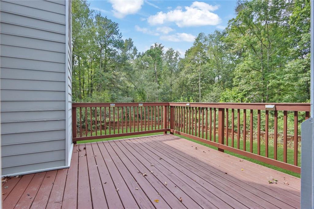 4645 Riveredge Cove Snellville, GA 30039 - Photo 43 of 43 a view of deck with wooden floor and fence