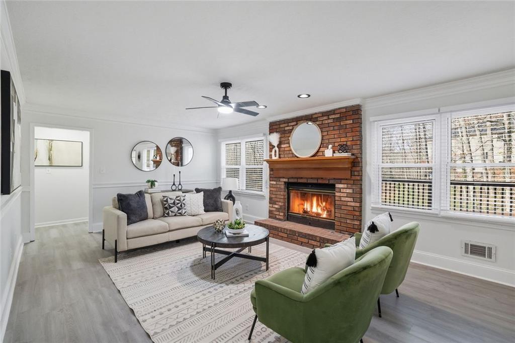 4645 Riveredge Cove Snellville, GA 30039 - Photo 6 of 43 a living room with furniture and a fireplace