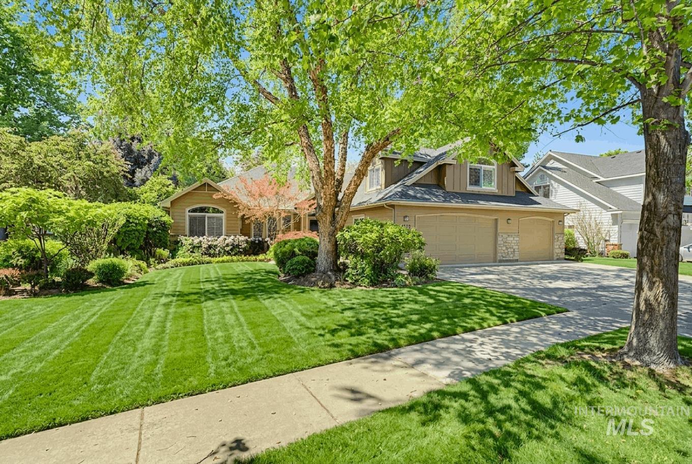 1579 North Watson Way Eagle, ID 83616 - Photo 1 of 30 Spacious front yard featuring mature trees and a manicured lawn