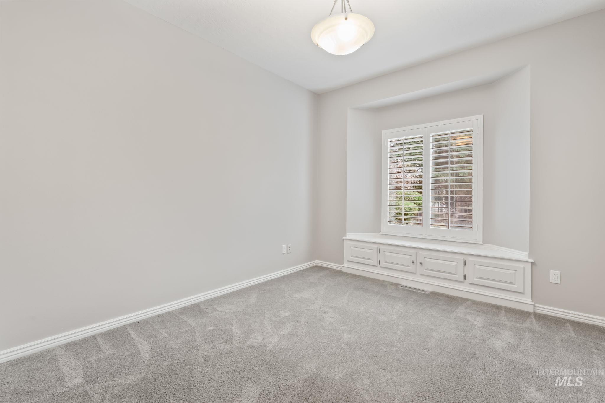 1579 North Watson Way Eagle, ID 83616 - Photo 17 of 30 Carpeted spare room featuring baseboards