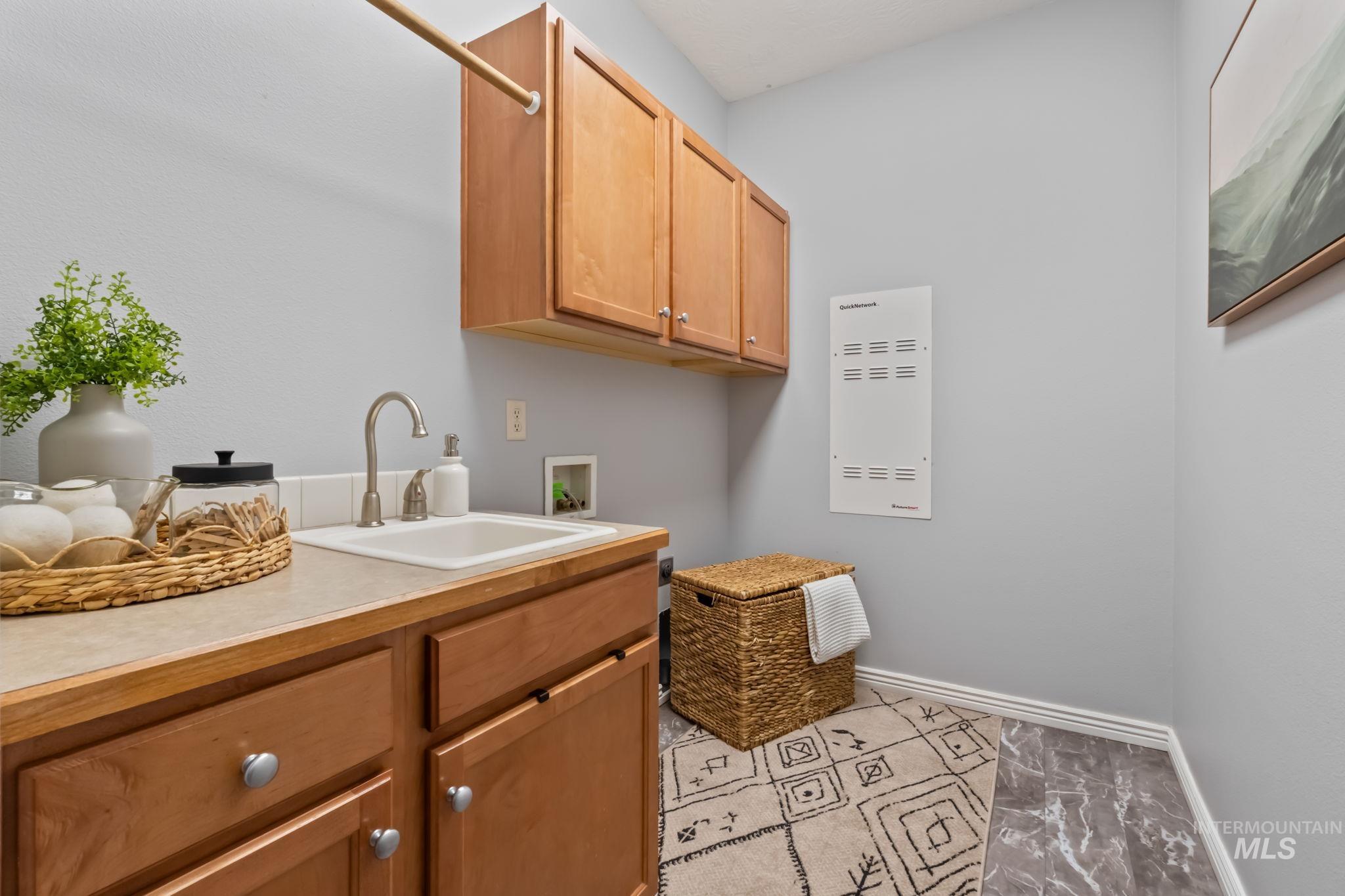 1579 North Watson Way Eagle, ID 83616 - Photo 20 of 30 Laundry area with cabinet space and washer hookup
