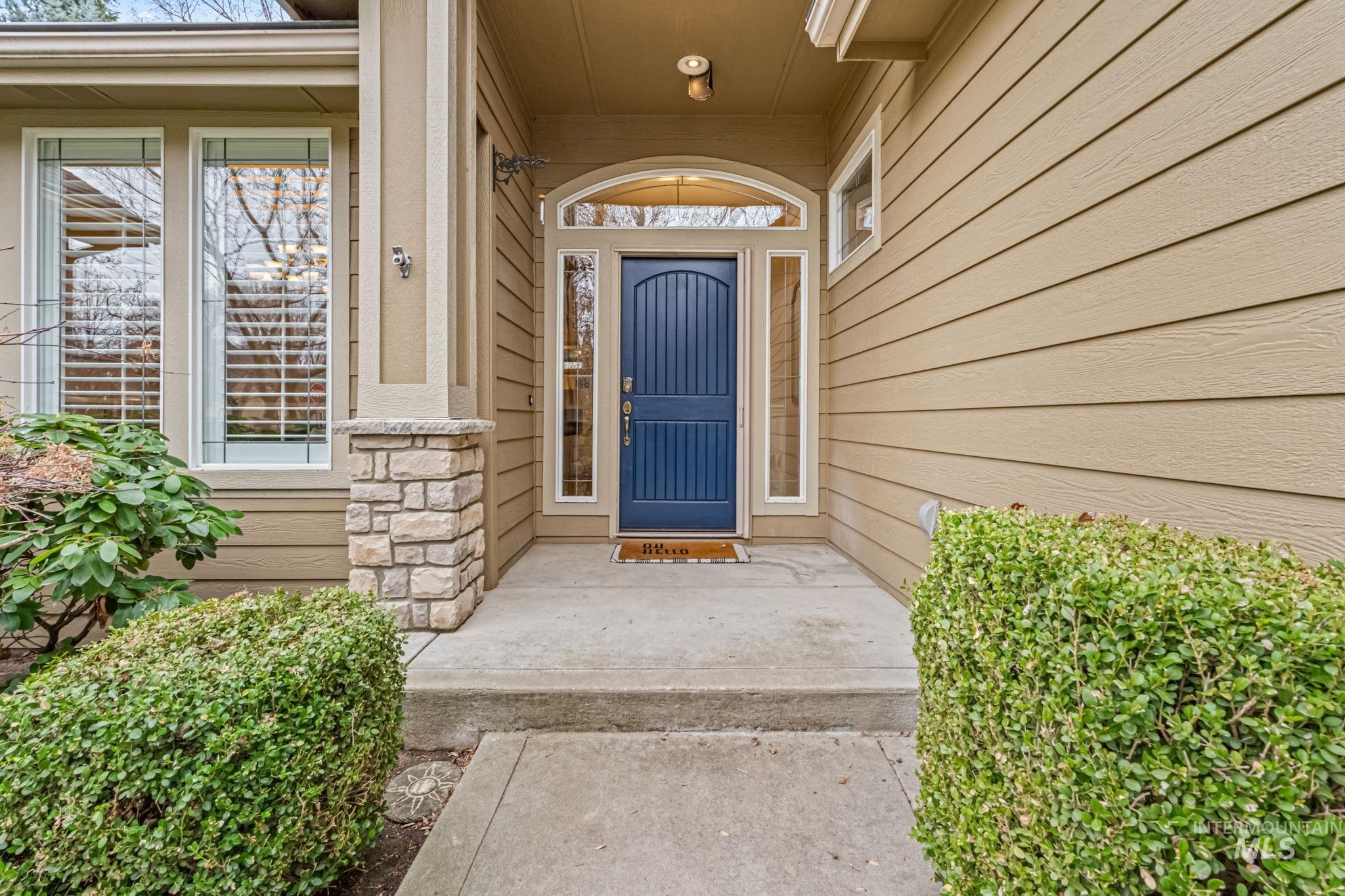 1579 North Watson Way Eagle, ID 83616 - Photo 3 of 30 Doorway to property with stone siding and a porch