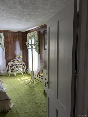a room with view of pool and patio