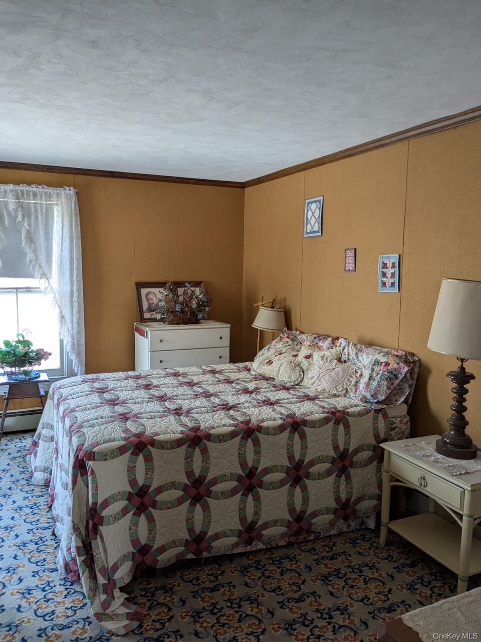 293 Carl Road Jewett, NY 12444 - Photo 22 of 49 a bedroom with a bed and wooden floor