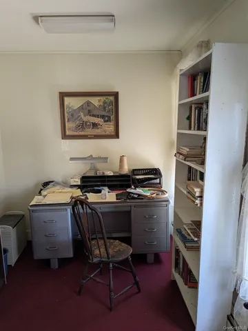 a view of a workspace with furniture