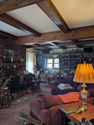 a living room with furniture a lamp and a fireplace
