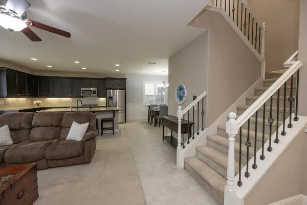 a living room with furniture fireplace and flat screen tv
