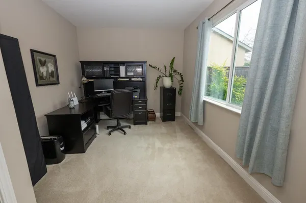 a spacious bathroom with a double vanity sink a large mirror a shower and bathtub