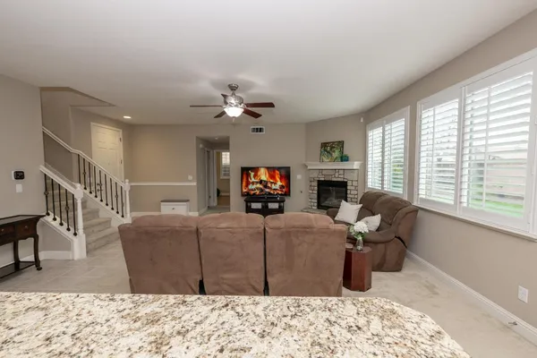 a bathroom with a double vanity sink mirror and shower