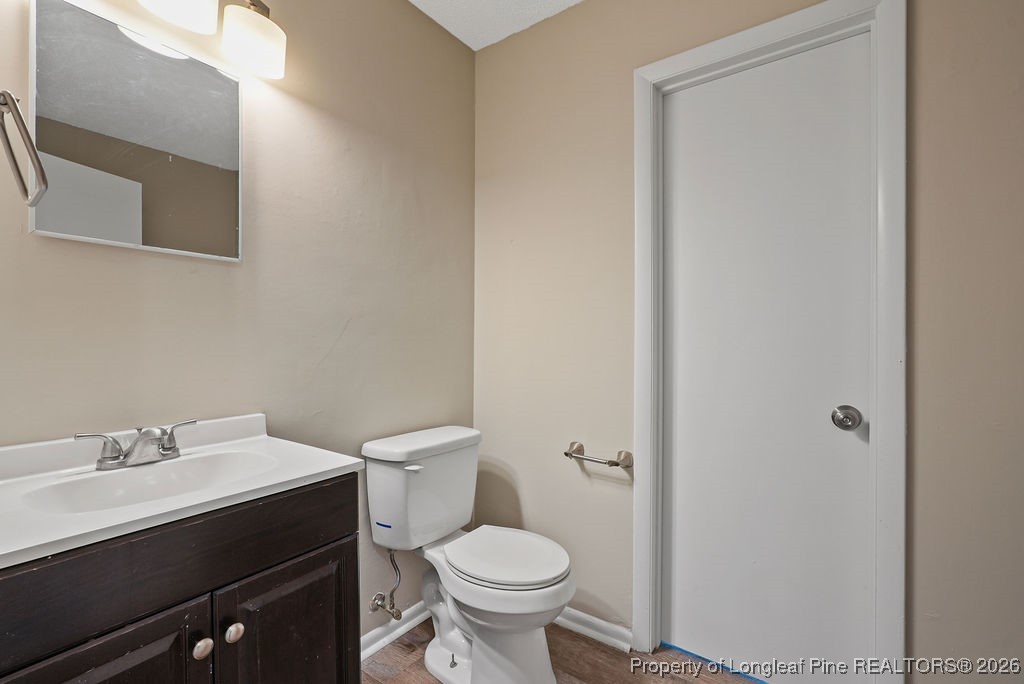 5314 Hornbeam Road Fayetteville, NC 28304 - Photo 12 of 15 a bathroom with a sink a toilet and a mirror