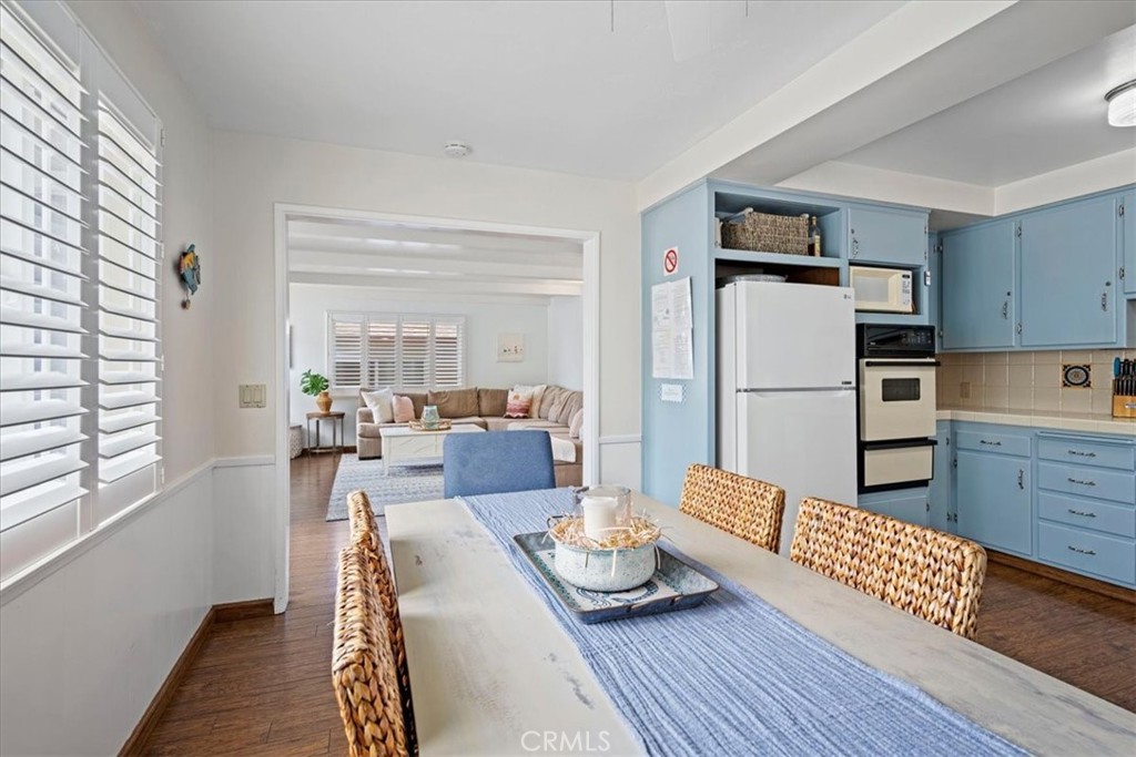 57 17th Street Cayucos, CA 93430 - Photo 11 of 24 a living room with furniture wooden floor and a refrigerator