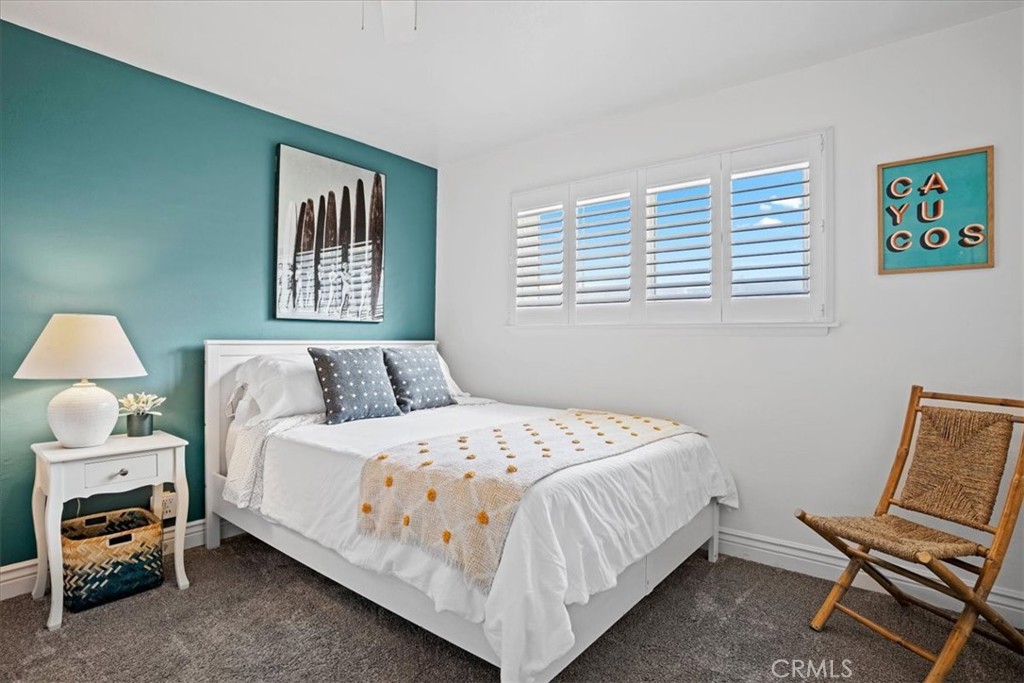 57 17th Street Cayucos, CA 93430 - Photo 14 of 24 a bedroom with a bed and a window
