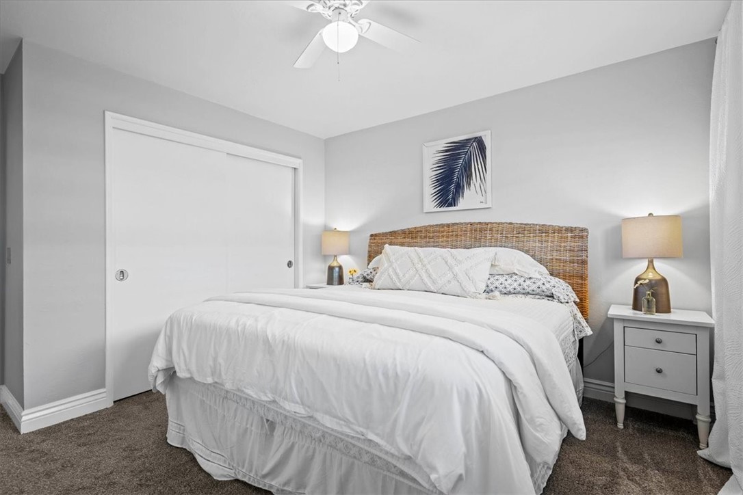 57 17th Street Cayucos, CA 93430 - Photo 17 of 24 a bedroom with a bed and a chandelier