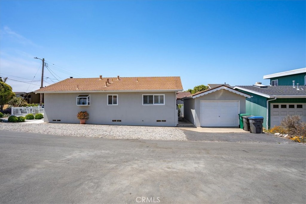 57 17th Street Cayucos, CA 93430 - Photo 23 of 24 a front view of a house with a garage