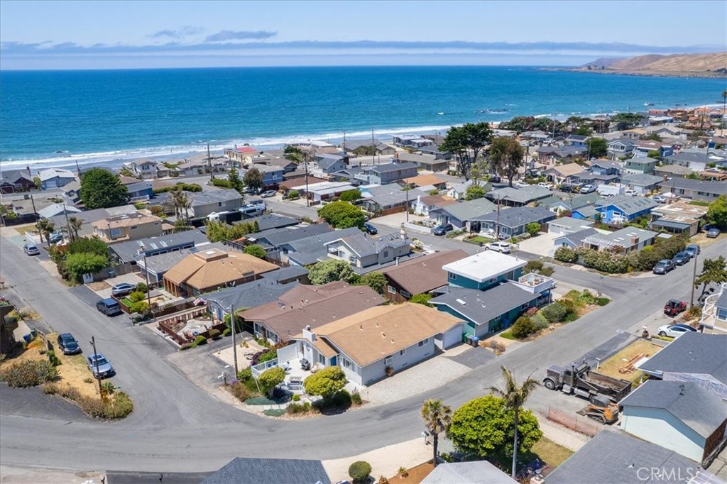 57 17th Street Cayucos, CA 93430 - Photo 3 of 24 an aerial view of a city with lots of residential buildings and ocean view in back