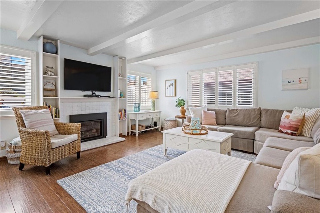 57 17th Street Cayucos, CA 93430 - Photo 10 of 24 a living room with fireplace furniture and a flat screen tv