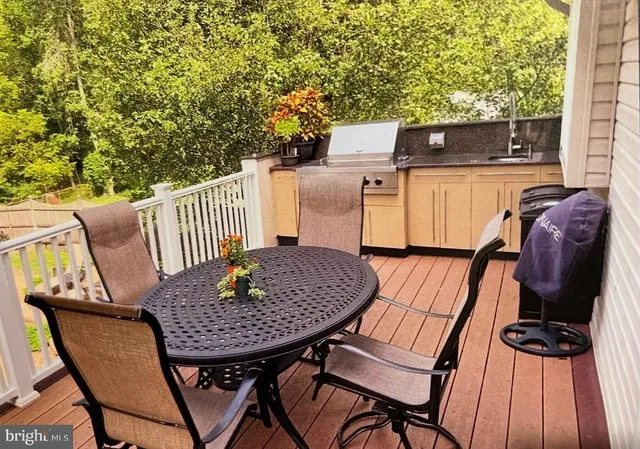a terrace of a house with outdoor seating