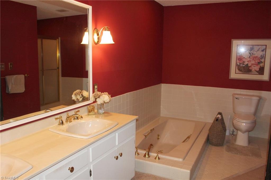 1502 Rogers Road Graham, NC 27253 - Photo 14 of 25 Master bathroom with jetted tub and separate shower plus double vanity.