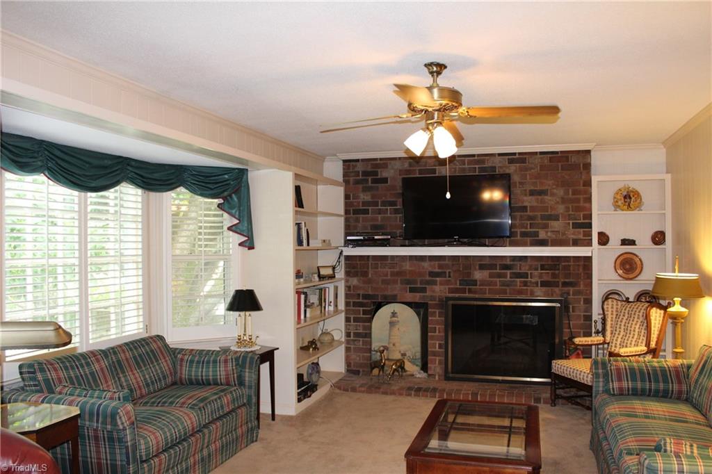 1502 Rogers Road Graham, NC 27253 - Photo 6 of 25 Den with masonry fireplace (gas logs) built-in book shelves