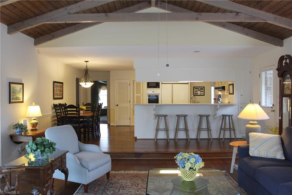1502 Rogers Road Graham, NC 27253 - Photo 10 of 25 Sun room and kitchen - there is a breakfast bar seating four.