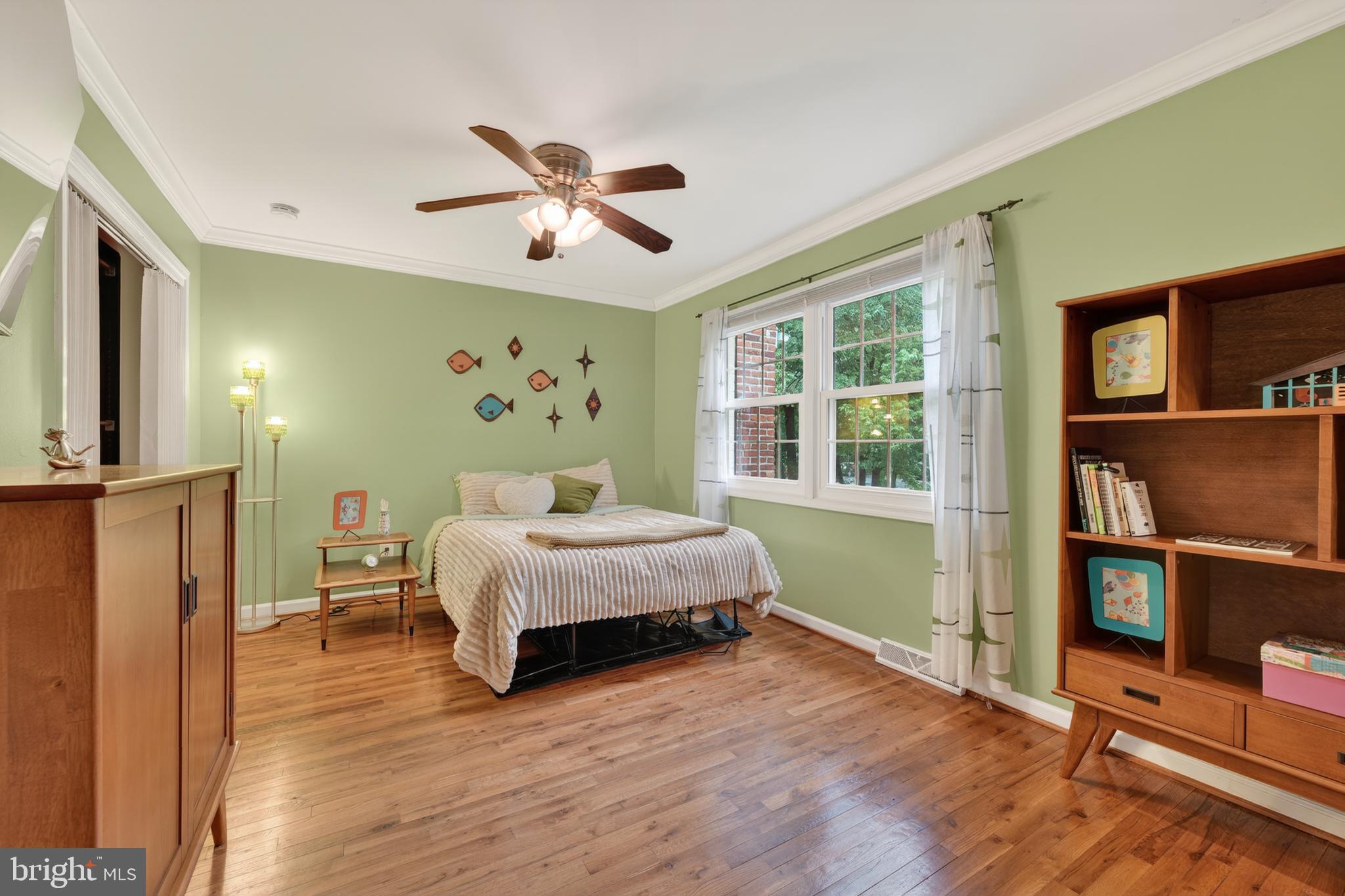 8139 Carrleigh Parkway Springfield, VA 22152 - Photo 22 of 27 a bedroom with a bed and a window