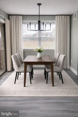 a view of a dining room with furniture and window