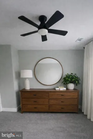 a bathroom with a sink a mirror and a toilet