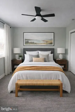 a bedroom with a bed and window